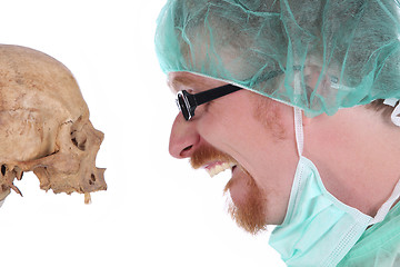 Image showing surgeon with skull