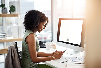 Image showing Black woman, smartphone and office smile at desk for social media, communication and typing text. Female business person at computer screen, contact and notification with meme, internet and app
