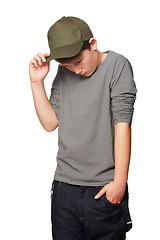 Image showing Fashion, cool and a shy teenager with a cap isolated on a white background in a studio. Serious, thinking and a young boy looking awkward, introverted and with shame while stylish in clothes