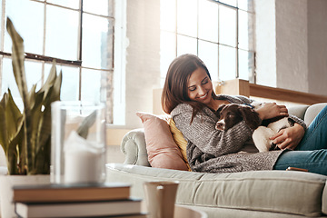 Image showing Smile, dog and woman on a couch, relax and love with joy, playful and carefree at home. Female person, girl and lady on a sofa, pet and happiness on a sofa, freedom and break with a domestic animal