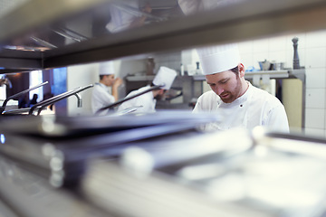 Image showing Team, employees and chef in a kitchen, catering and prepare delicious meal with equipment. Professional, coworkers or staff with workspace, utensils or start dinner rush with food industry or cooking