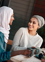 Image showing Friends, coffee and happy with Muslim women in cafe for conversation, food and social. Smile, relax and culture with arabic female customer in restaurant for discussion, happiness and meeting