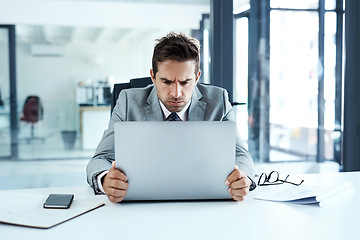 Image showing Stress, frown and angry man on laptop in office frustrated with glitch, mistake or crisis. Anxiety, face and business person with failure or problem, 404 or bad review, deadline report or tech delay