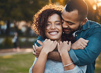 Image showing Love, hug and couple in park, smile and joy with romance, bonding and relationship with happiness. Portrait, partners or man with woman, embrace, outside or marriage with wellness, loving or carefree