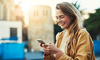 Image showing Woman laughing at meme on cellphone, communication in city and chat on social media with connectivity outdoor. Happy female person in urban street, text contact with mobile app and comedy online