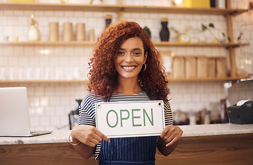 Image showing Portrait, woman and smile with open sign in cafe, shop and store for retail trading time, board and advertisement. Happy restaurant owner opening small business with signage, information and welcome