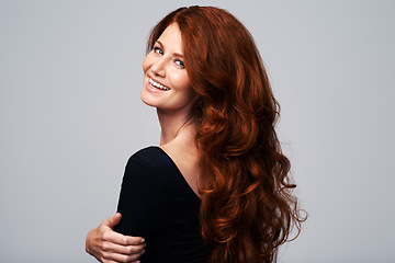 Image showing Portrait, smile and woman with hair care, beauty and wellness against grey studio background. Face, female person and lady with salon treatment, grooming and luxury with hairstyle, cheerful and happy