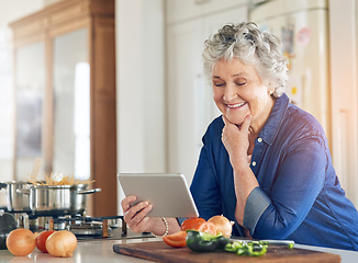 Image showing Tablet, cooking vegetables or happy old woman in kitchen while online for learning on recipe blog at home. Smile, healthy food or senior person on digital app to search for a vegan diet on website