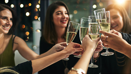 Image showing Toast, party and champagne with friends at restaurant for celebration, wine and social event. Happy, diversity and luxury with group of people drinking together for fine dining, cheers and free time