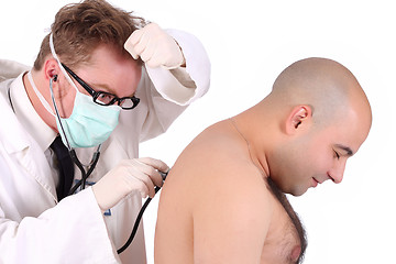 Image showing funny doctor checking a patient 