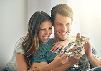 Image showing Kitten, love or happy young couple play and in their home. Support or caring, smiling people with animal and happy family with cat pet spending quality or bonding time in living room at house