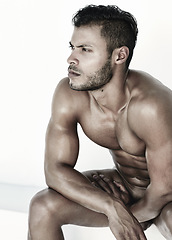 Image showing Model, thinking and naked man body for fitness training, exercise ideas and workout plan. Serious, muscle and young nude male athlete with focus, health idea and looking sexy at the gym for lifestyle