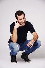 Image showing Man, portrait and call me hand sign of a person with flirty and emoji gesture in studio. Isolated, grey background and male model with a smile and happiness from flirt and casual fashion alone