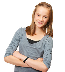 Image showing Young teen, portrait and arms crossed in a studio with a smile and youth confidence. White background, female teenager and preteen person with casual fashion and style with happiness of model