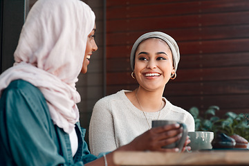 Image showing Happy, coffee and smile with Muslim women in cafe for conversation, food and social. Friends, relax and culture with arabic female customer in restaurant for discussion, happiness and meeting