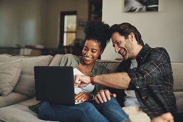 Image showing Laptop, interracial and entertainment with a couple watching a video using an online subscription service to relax. Computer, streaming or internet with a man and woman bonding together over a movie