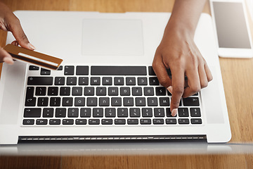 Image showing Woman, hands and credit card payment on laptop for online shopping, ecommerce or internet store. Above hands of a female entrepreneur typing at desk for business banking, booking or fintech website