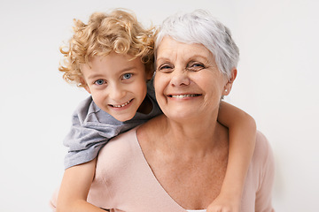 Image showing Piggyback, portrait and grandmother with child embrace, happy and bonding against a wall background. Love, face and senior woman with grandchild having fun, hug and enjoying the weekend together