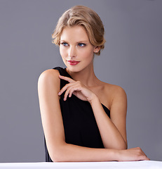 Image showing Woman, beauty and evening dress with thinking in studio with fashion, memory and glamour by gray background. Girl, luxury and clothes for prom, award show and cosmetics for aesthetic by backdrop