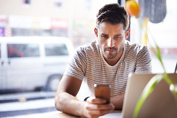 Image showing Phone, laptop or man in cafe reading news on social media for an update on the stock market for trading. Coffee shop, entrepreneur or trader texting on mobile app or networking on internet or website