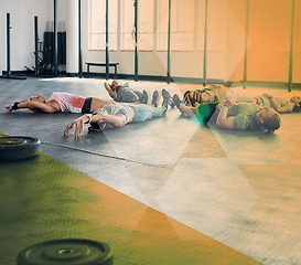 Image showing Fitness, exercise and group of people lying in circle for workout, training or relax in class. Athlete men and women together for challenge, commitment and rest or meditation at club with overlay