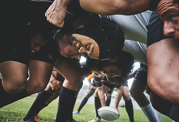 Image showing Sports, rugby and players in a scrum on a field during a game, workout or training in a stadium. Fitness, performance and group of athletes in position on an outdoor grass pitch for match or practice