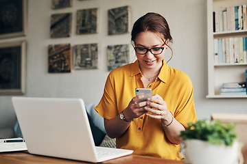 Image showing Phone, laptop and smile with woman in home office for networking, social media and remote worker. Communication, contact and internet with female freelancer for technology, blog and email planning