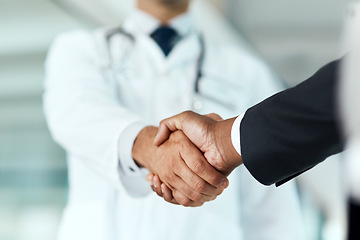 Image showing Closeup, doctor or man with handshake, negotiation or planning with partnership, healthcare or wellness. Medical professional, consultant or employee with an offer, support or teamwork with promotion