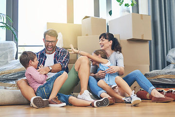 Image showing Happy, family and moving with boxes in apartment on the floor are excited with the mortgage. Parents, children and new home for investment are playful with box in the living room of property.