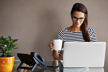 Image showing Laptop, coffee and happy business woman in office smile, satisfied and content against a wall background. Tea, research and female worker online for planning, browsing and creative inspiration