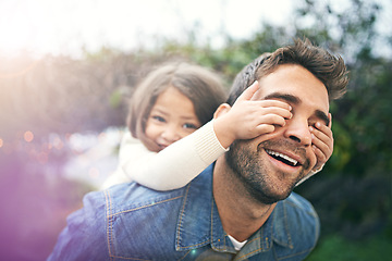 Image showing Happy, piggyback and playful with father and daughter in nature for bonding, laughing and affectionate. Smile, relax and happiness with man carrying young child in park for support, weekend and care