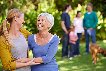 Image showing Family, mother and adult daughter hug outdoor, spending quality time in garden together with happiness and care. Happy women are content in relationship with love, laughter and carefree in nature