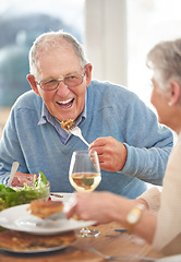 Image showing Happy, love and elderly couple eating lunch together in the dining room of their modern home. Happiness, smile and senior man and woman in retirement talking, bonding and enjoying meal in their house