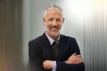 Image showing Portrait, vision and arms crossed with a business man in his office, looking happy about his company growth. Mission, mindset and confidence with a senior male corporate manager standing at work