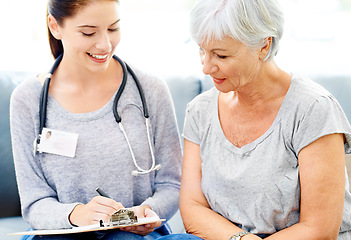 Image showing Health, checklist and senior woman care with nurse for insurance and medical consultation. Elderly female patient, healthcare worker and smile in a hospital and clinic with medic paperwork and help