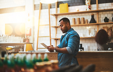 Image showing Focus, tablet and manager with man in cafe for online, entrepreneurship and startup. Retail, technology and food industry with small business owner in restaurant for barista, store and coffee shop