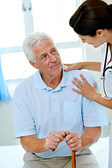 Image showing Support, nurse and old man with cane in hospital for advice, help and rehab at senior care clinic. Healthcare in retirement, counselling and elderly patient with disability on bed with woman doctor