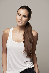 Image showing Fashion, casual and portrait of woman isolated on studio background with smile, long hair and cool clothes. Happy young model or beautiful person from Germany standing in trendy outfit for promotion
