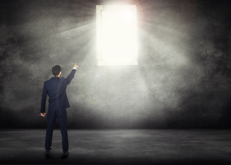 Image showing Back, opportunity and a business man with window light for access on a dark background with mockup. Wall, career and male professional and CEO pointing the way to future growth, success or leadership