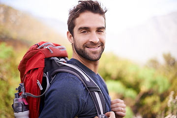 Image showing Hiking, smile and portrait of man on mountain for fitness, adventure and travel journey. Backpacking, summer and workout with male hiker trekking in nature path for training, freedom and explore