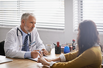 Image showing Healthcare, doctor and woman in consultation, conversation and discussion for diagnosis in an office. Female patient, medical professional and male employee in the hospital, treatment and talking