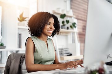 Image showing Research, smile and business woman on a computer in office, happy and satisfied with web search. Online, review and African female person smiling for report, proposal or creative design inspiration