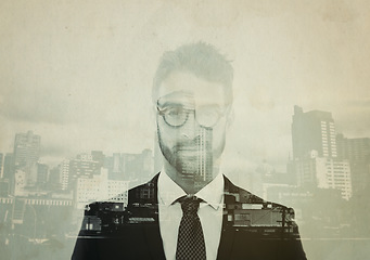 Image showing Business man, urban portrait and double exposure with professional, cbd skyline and focus in suit. Young businessman, face or employee with overlay in urban metro with skyscraper, smile and vision