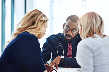 Image showing Healthcare, couple and doctor with help, consultation and conversation in an office, planning treatment or diagnosis. Medical professional, partners or employee with patients, advice or communication