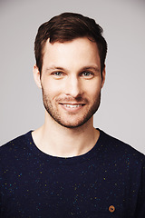 Image showing Man, portrait and smile of a happy person with confidence and casual style in a studio. Isolated, gray background and face of a male model and young person with modern fashion and stylish clothes
