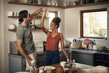 Image showing Happy couple, dance and fun bonding in kitchen for romance, love or holiday together at home. Interracial man and woman dancing in happiness for romantic relationship or enjoying weekend in the house