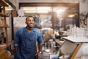 Image showing Coffee shop, barista and happy man in cafe for service, working and thinking in restaurant. Small business owner, entrepreneur startup and male bistro waiter smile by cafeteria counter ready to serve