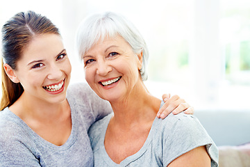 Image showing Portrait, happy woman and senior mom on sofa, bonding and happiness together in living room. Smile, mother and daughter on couch, love and weekend quality time to relax with mock up in family home.