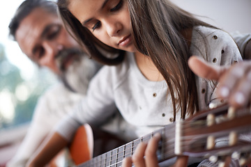 Image showing Girl learning to play guitar, grandfather teaching child with music education and help with creativity. Musician, art and mature man helping female kid learn focus and skill on musical instrument