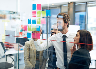 Image showing Collaboration, team of colleagues working on strategy and schedule in office. Teamwork, communication and coworkers planning or brainstorming ideas together for project or assignment at workplace